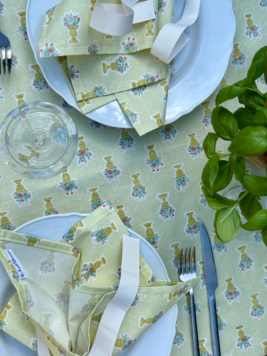 Green garden party tablecloth and matching set of 4 napkins made from Liberty cotton fabric, featuring a floral print ideal for outdoor gatherings or elegant dining.
